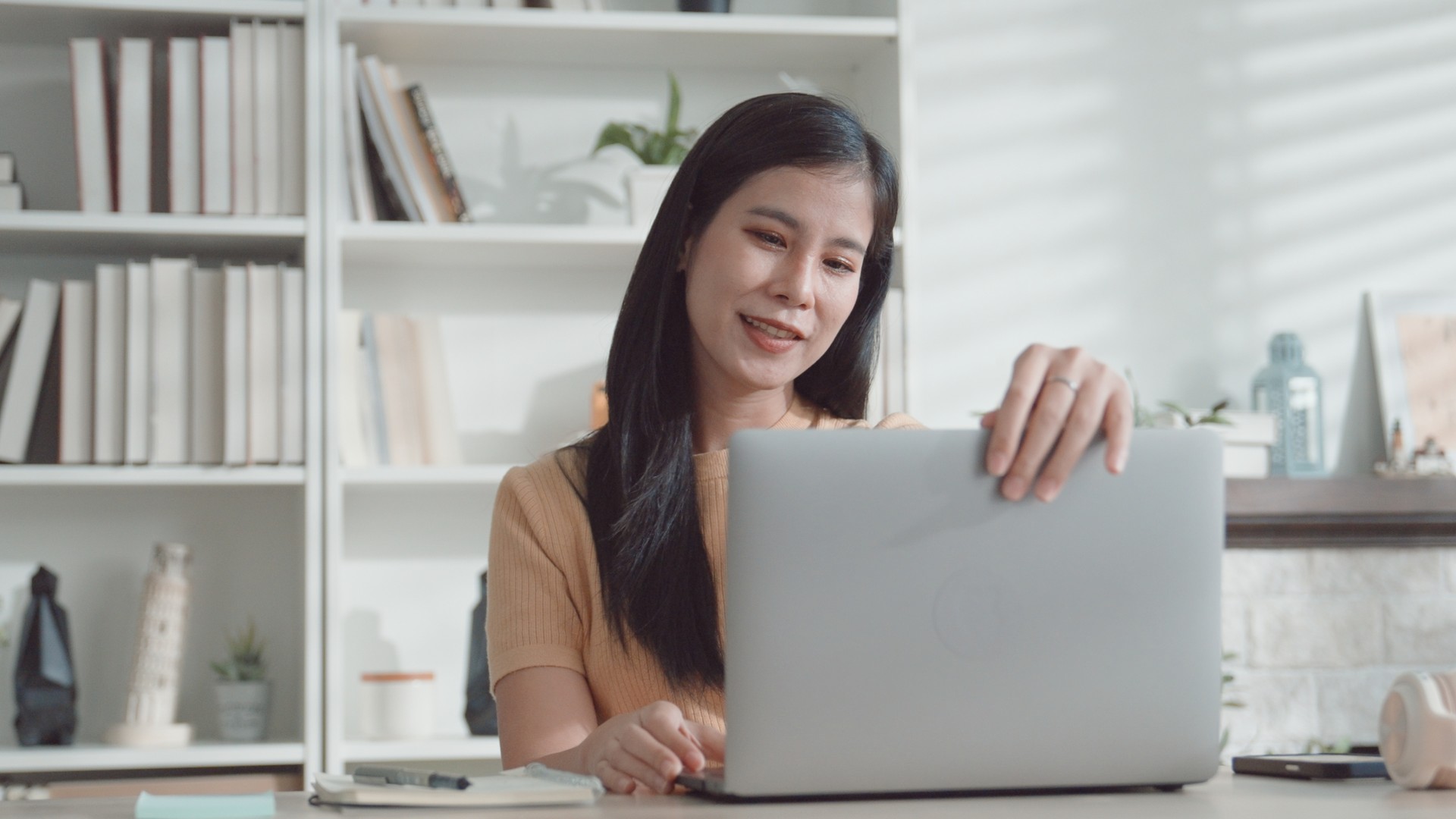 Asian young woman working from home,  e-learning at home